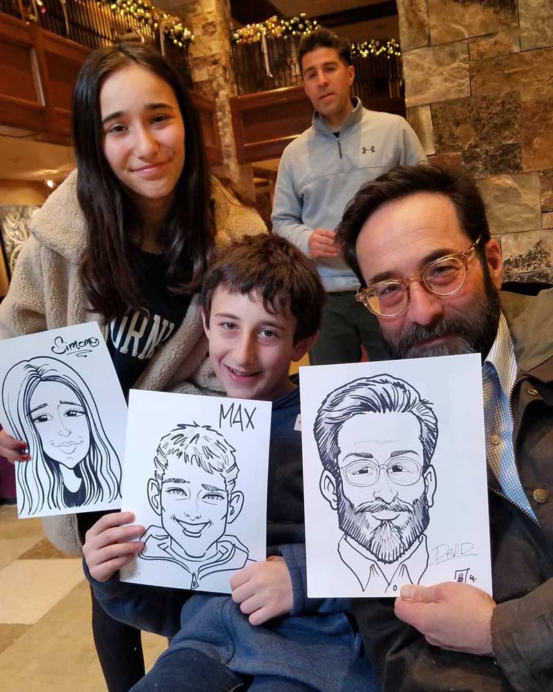 Caricature artist drawing guests at a Christmas party