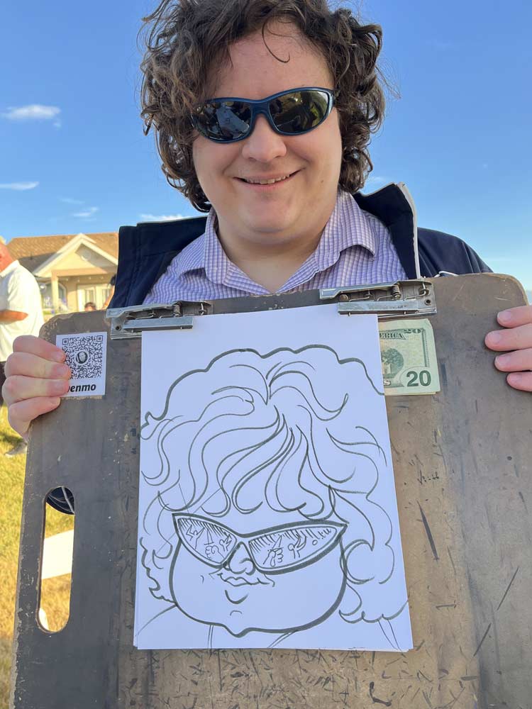 Caricature artist drawing guests at an event in Ogden Utah